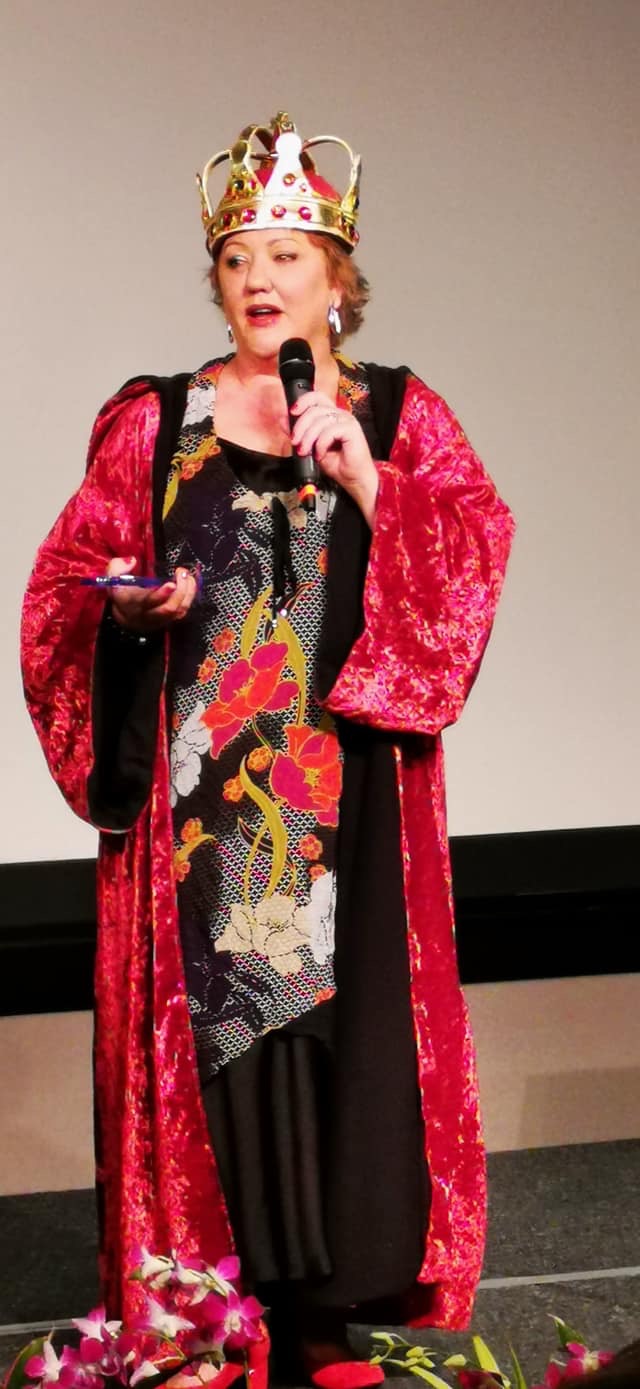 Andrea Edwards speaking in her Queen costume