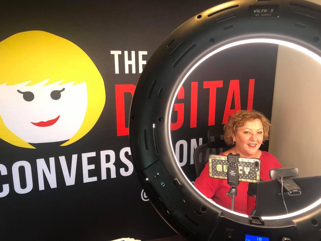 Andrea Edwards speaking virtually through a digital broadcast setup