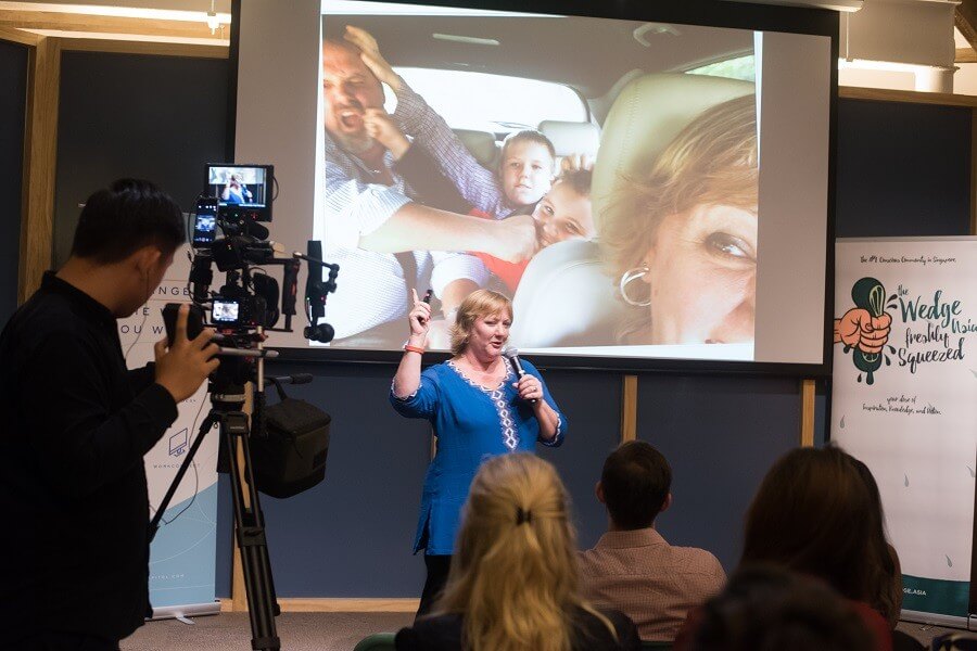 Andrea speaking to a room during a Social Leadership session